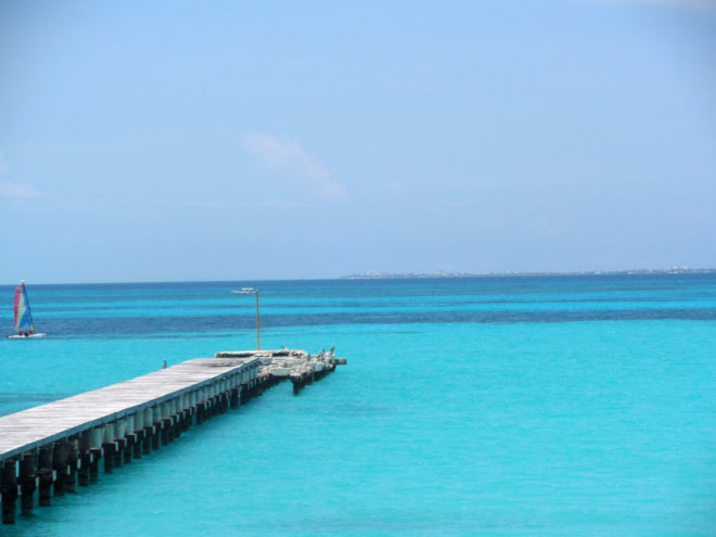 A pier in the crystal blue waters of cancun