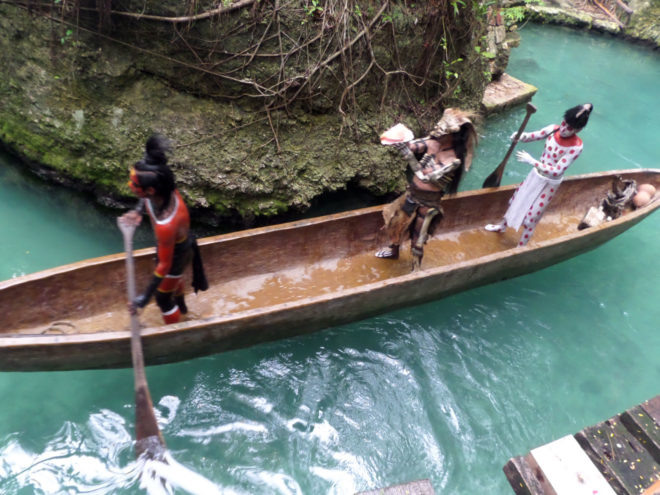Mayan warriors in a boat