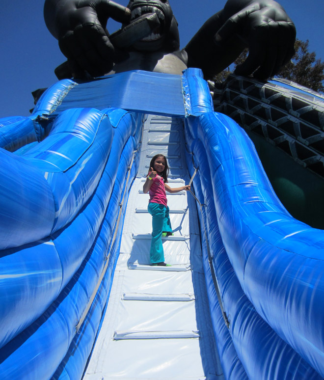 Madi climbing the tallest inflatable slide