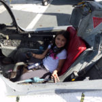 Madi in the cockpit of a T-2 Buckeye