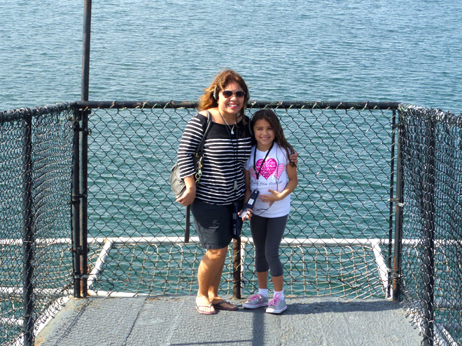 Laura and Madi stand on the Flight Deck Horns of the USS Midway