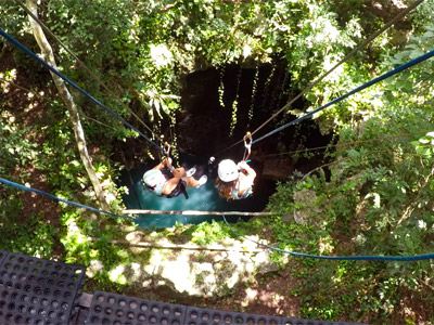 Xenotes Tour Rappelling into Cenote